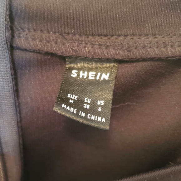 Black mini dress with asymmetrical ruffle - Picture 3 of 3